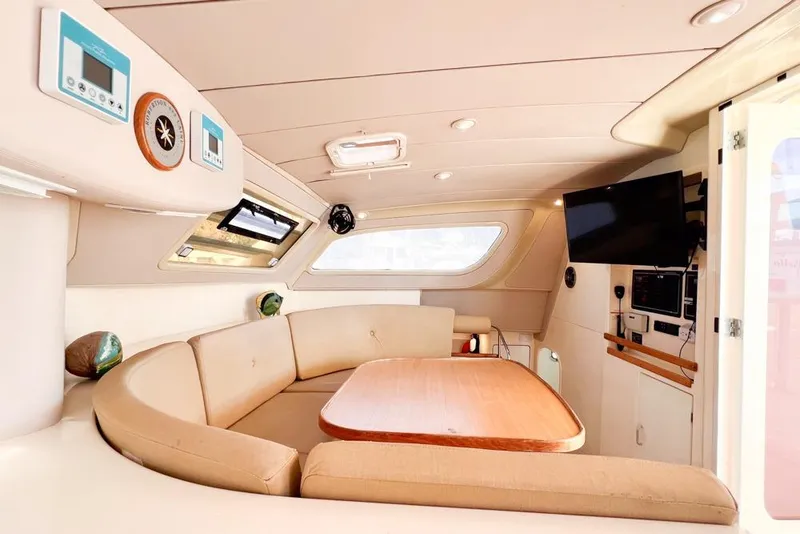 Slide: The Image of Luxurious interior of a 2000 Leopard 38 yacht with cozy seating and modern amenities. - 77
