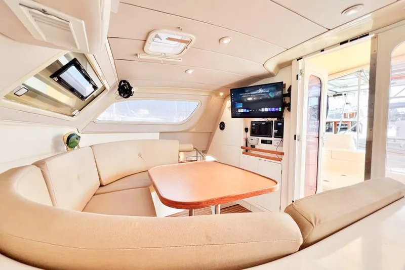 Slide: The Image of Luxurious interior of 2000 Leopard 38 yacht with cozy seating and modern amenities. - 79