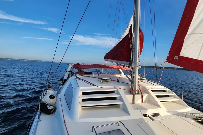 Slide: The Image of Aerial view of a 2000 Leopard 38 catamaran docked at a marina. - 8