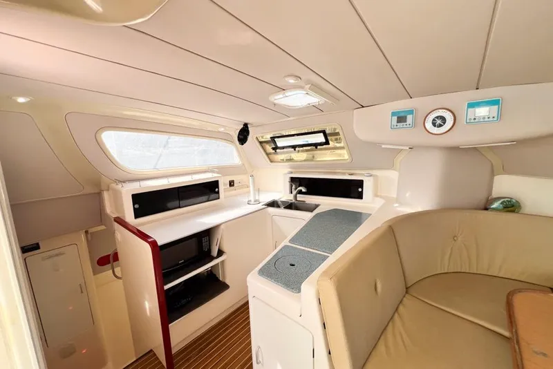 Slide: The Image of Interior of 2000 Leopard 38 yacht with modern kitchen and seating area. - 82