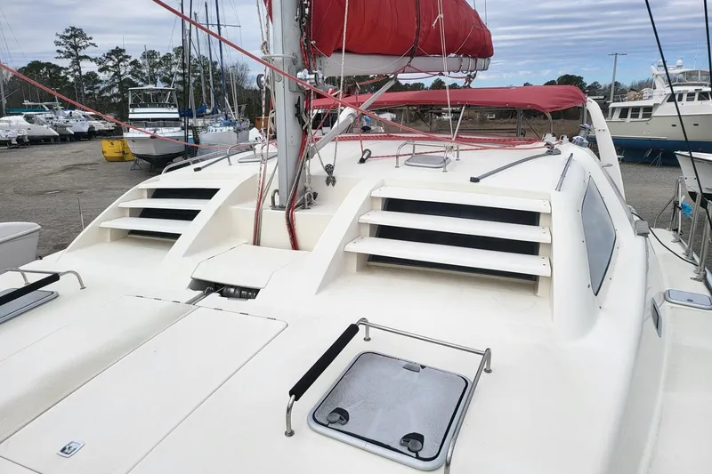 Slide: The Image of Aerial view of a 2000 Leopard 38 catamaran docked in a marina. - 9