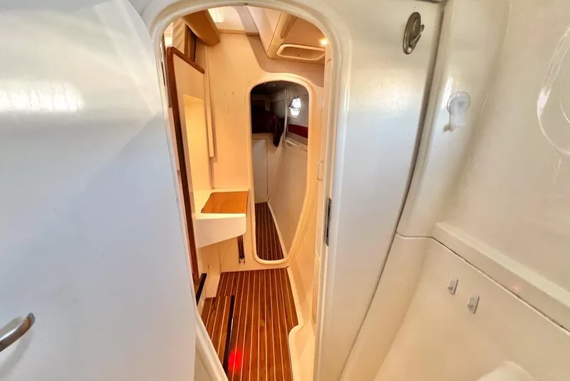 Slide: The Image of Interior view of a 2000 Leopard 38 yacht with wooden flooring and sleek design. - 95