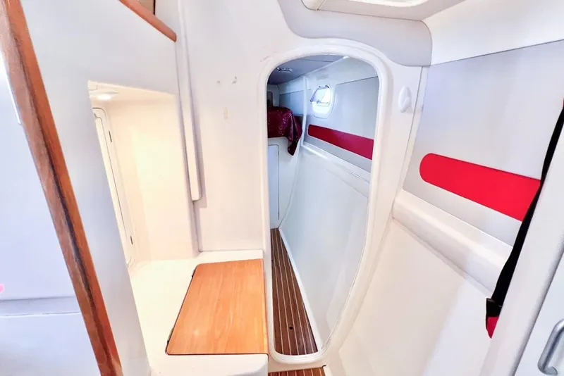 Slide: The Image of Interior of 2000 Leopard 38 catamaran with modern design and wooden flooring. - 96