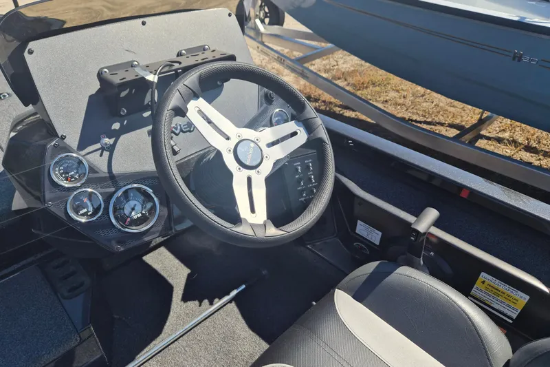 Slide: The Image of 2023 Vexus AVX1880 boat cockpit with steering wheel and instrument panel. - 8