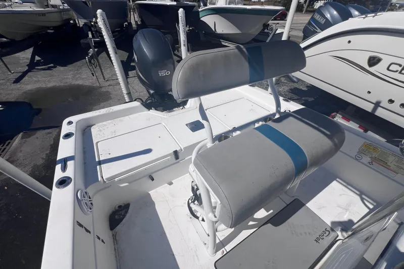 Slide: The Image of 2008 Skeeter ZX20 Bay boat interior with Yamaha 150 engine, featuring seating and storage. - 15