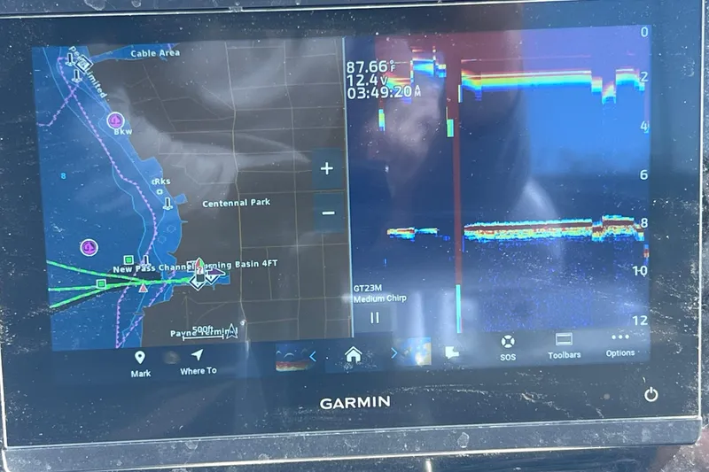 Slide: The Image of Garmin marine GPS display on 2008 Skeeter ZX20 Bay boat, showing navigation and sonar data. - 18