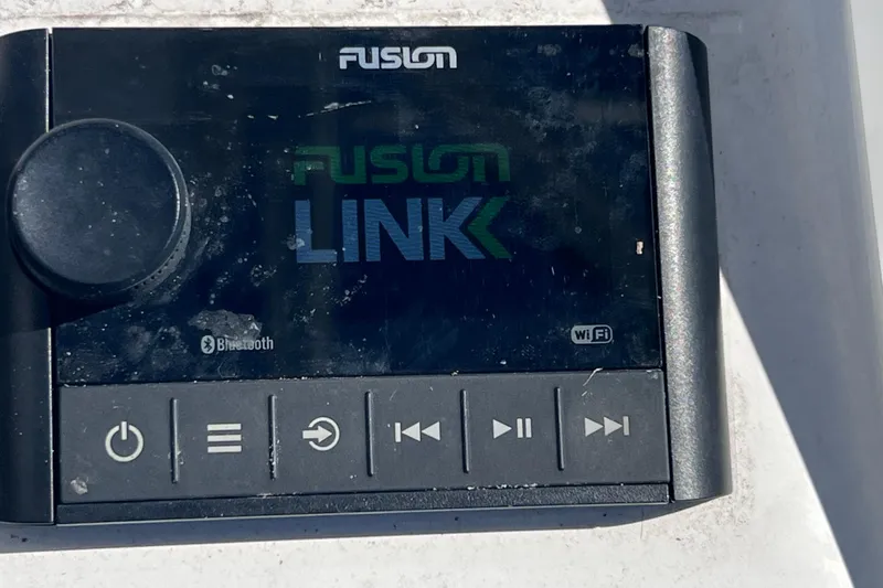 Slide: The Image of Fusion marine audio system with Bluetooth and WiFi on a 2008 Skeeter ZX20 Bay boat. - 20