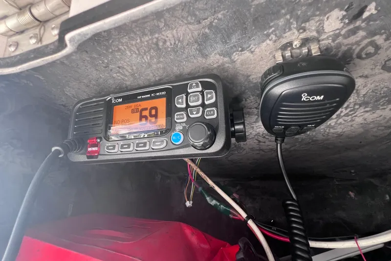 Slide: The Image of VHF marine radio and microphone installed on a 2008 Skeeter ZX20 Bay boat. - 24