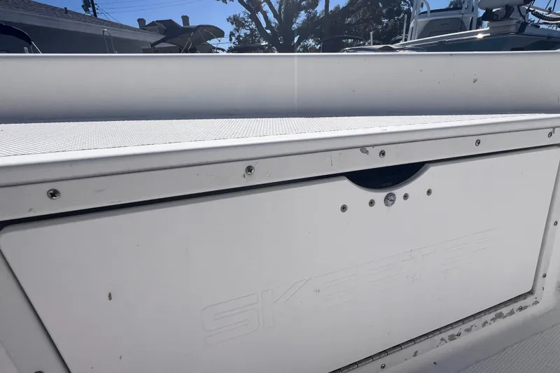 Slide: The Image of 2008 Skeeter ZX20 Bay boat storage compartment, white exterior, close-up view. - 32