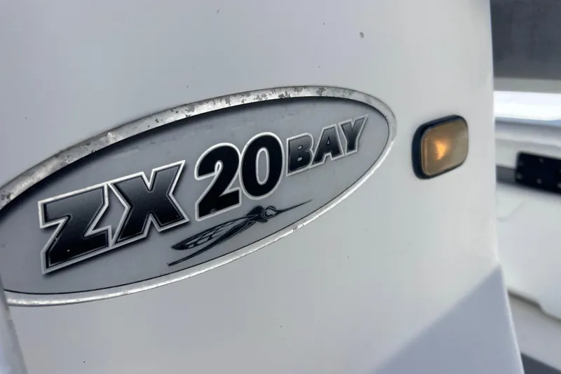 Slide: The Image of 2008 Skeeter ZX20 Bay boat logo on white surface. - 37