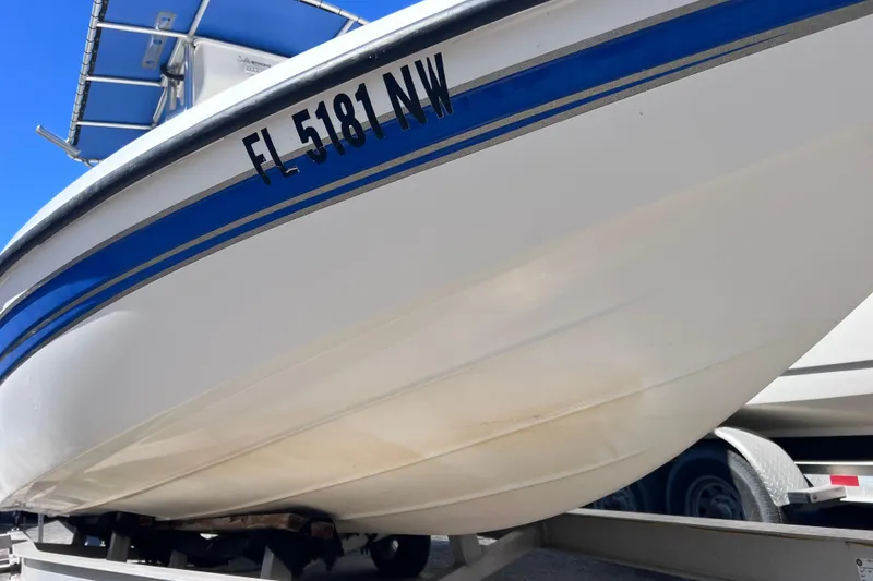 Slide: The Image of 2008 Skeeter ZX20 Bay boat on trailer, featuring blue stripe and registration number FL 5181 NW. - 4