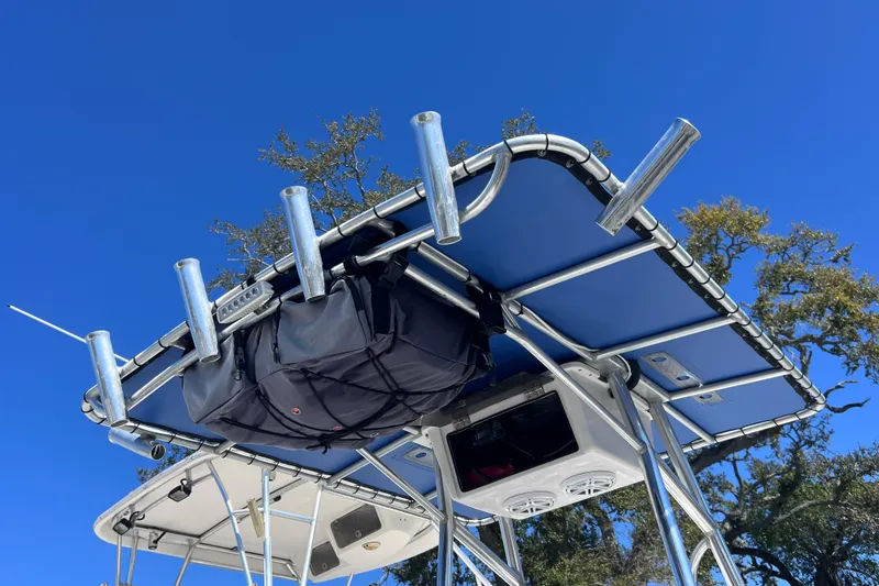 Slide: The Image of 2008 Skeeter ZX20 Bay boat with rod holders and canopy against clear blue sky. - 7