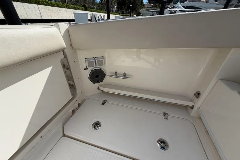 Slide: The Image of Interior view of 2022 Boston Whaler 320 Vantage boat, featuring seating and storage. - 16