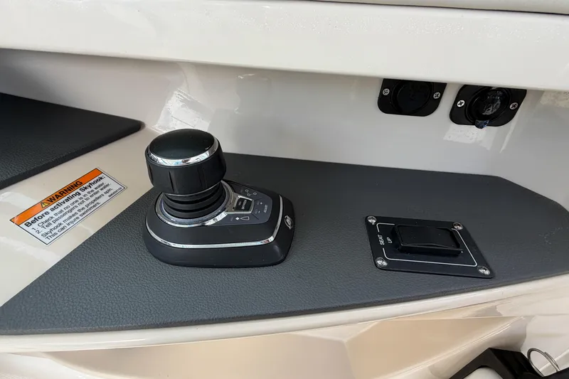 Slide: The Image of Control panel of 2022 Boston Whaler 320 Vantage boat with joystick and switches. - 30