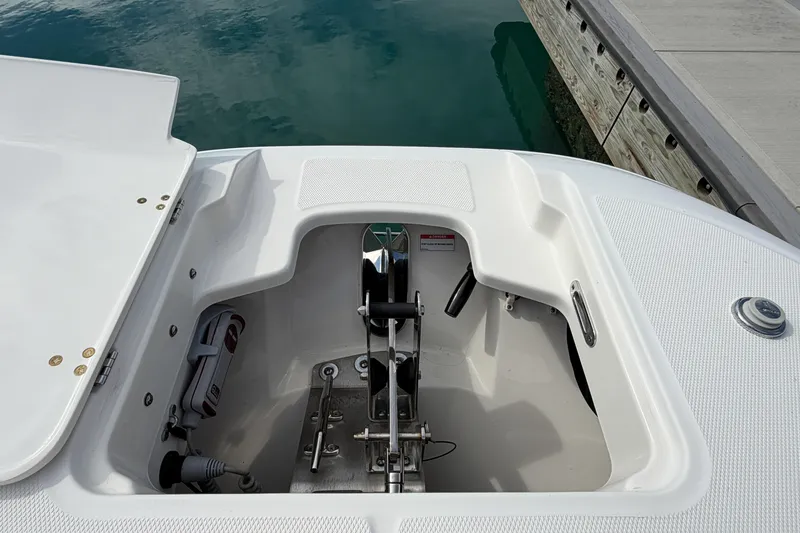 Slide: The Image of 2022 Boston Whaler 320 Vantage anchor compartment at dockside. - 43