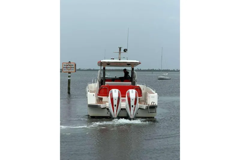Slide: The Image of Nimbus T-11 2021 boat with dual engines on calm water. - 3