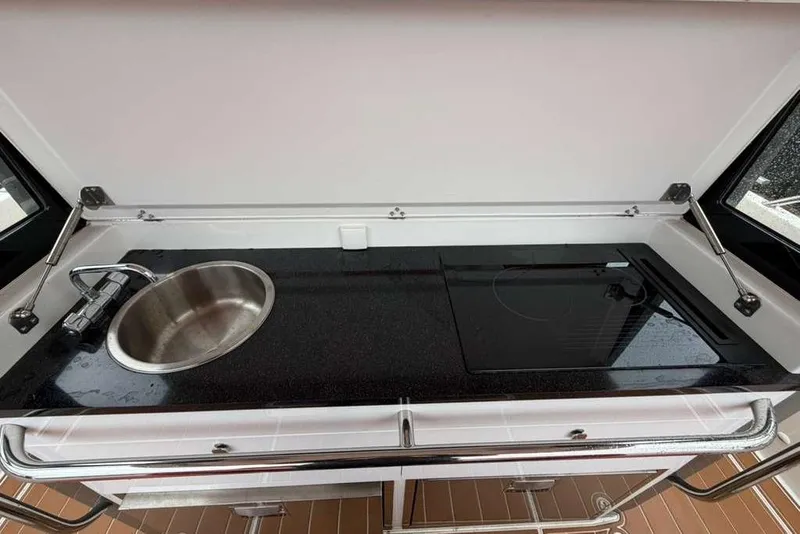 Slide: The Image of Luxurious interior of 2021 Nimbus T-11 boat with wood paneling and cozy bed. - 10