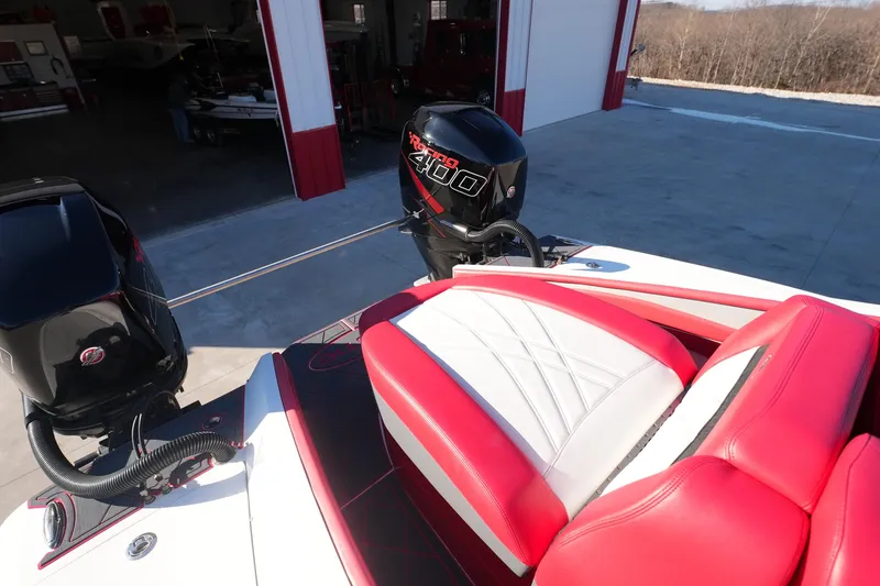 Slide: The Image of 2019 Mystic Powerboats C3800 with red and white seating, featuring powerful outboard engines. - 16