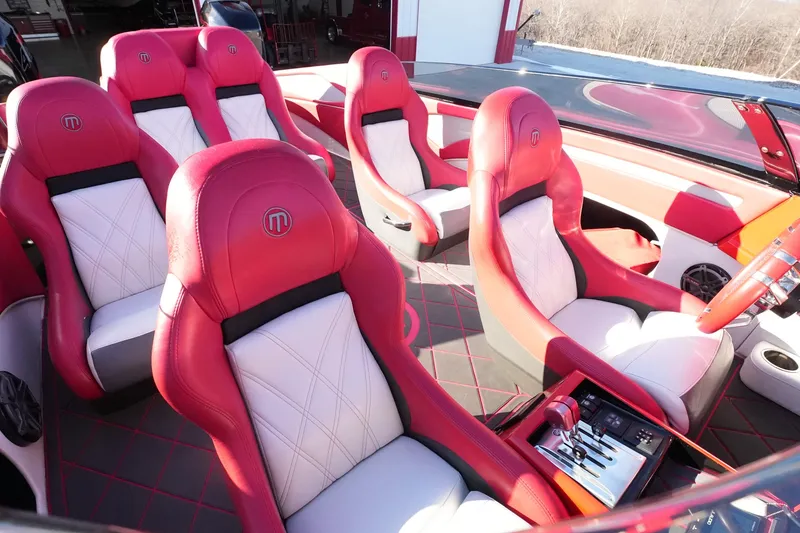 Slide: The Image of 2019 Mystic Powerboats C3800 interior with red and white luxury seating. - 18