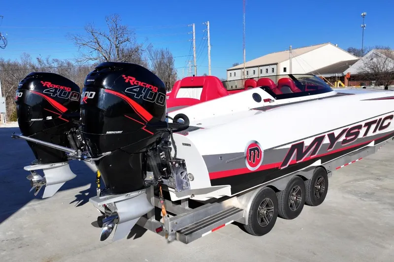 Slide: The Image of 2019 Mystic Powerboats C3800 with dual Mercury Racing 400R engines on a trailer. - 2