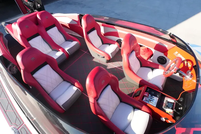 Slide: The Image of 2019 Mystic Powerboats C3800 interior with red and white seating, modern dashboard, and sleek design. - 20