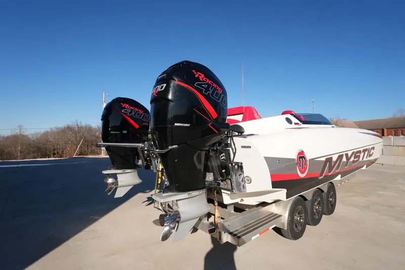 Slide: The Image of 2019 Mystic Powerboats C3800 with dual Mercury Racing 400R engines on a trailer. - 25