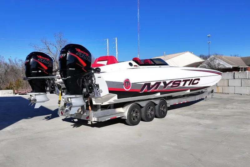Slide: The Image of 2019 Mystic Powerboats C3800 with twin Mercury Racing 400R engines on a trailer. - 3
