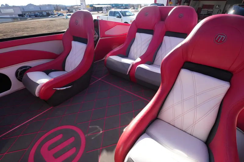 Slide: The Image of 2019 Mystic Powerboats C3800 interior with red and white luxury seating. - 32