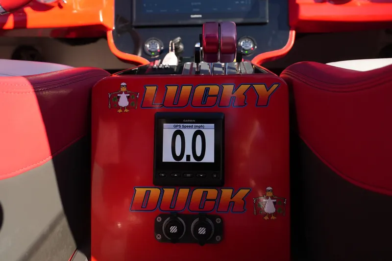 Slide: The Image of 2019 Mystic Powerboats C3800 dashboard with "Lucky Duck" design and GPS speed display. - 37