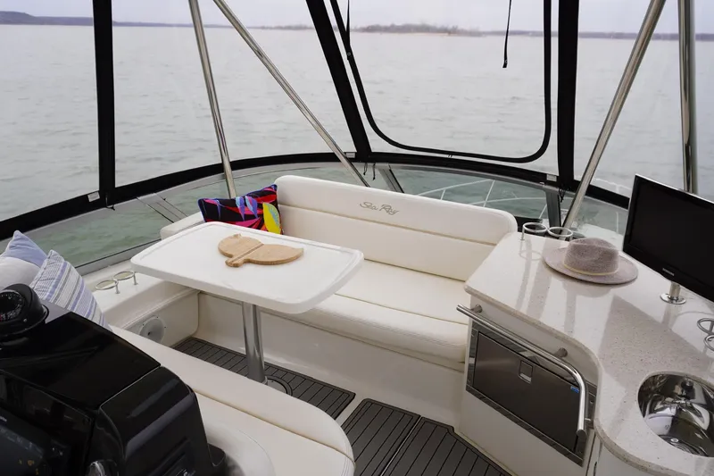 Slide: The Image of Interior of 2009 Sea Ray 47 Sedan Bridge yacht with seating and table. - 22