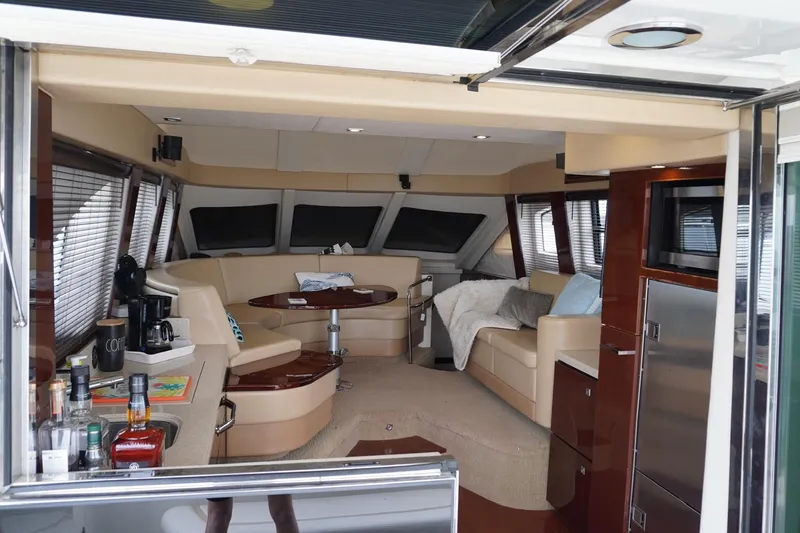 Slide: The Image of Luxurious interior of a 2009 Sea Ray 47 Sedan Bridge yacht with elegant seating and amenities. - 29