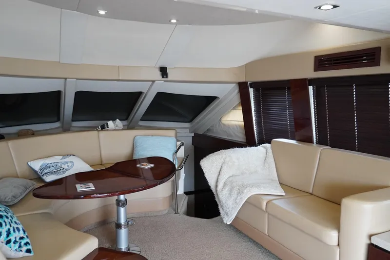 Slide: The Image of Luxurious interior of 2009 Sea Ray 47 Sedan Bridge yacht with plush seating and elegant decor. - 31