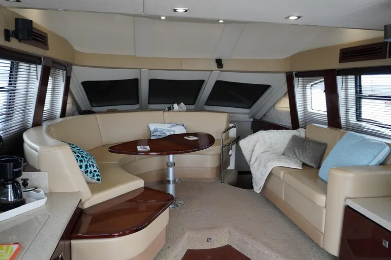 Slide: The Image of Luxurious interior of 2009 Sea Ray 47 Sedan Bridge yacht with plush seating and elegant decor. - 32