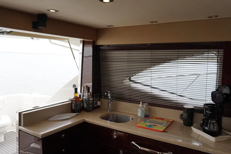 Slide: The Image of Interior of 2009 Sea Ray 47 Sedan Bridge yacht with kitchenette and ocean view. - 35
