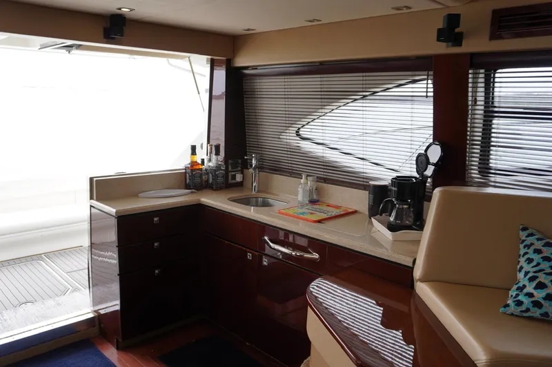 Slide: The Image of Luxurious interior of 2009 Sea Ray 47 Sedan Bridge yacht with modern kitchen amenities. - 36