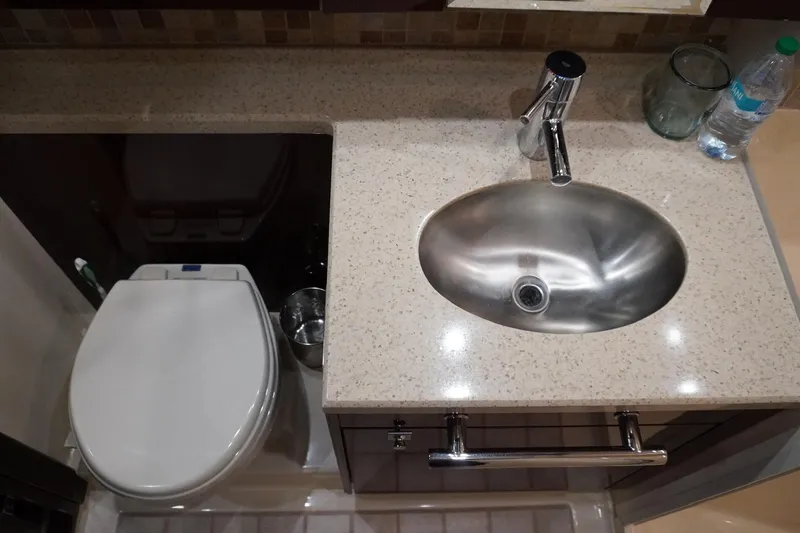 Slide: The Image of Bathroom interior of 2009 Sea Ray 47 Sedan Bridge with sink and toilet. - 40
