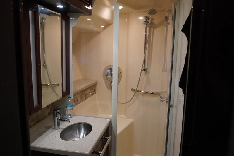 Slide: The Image of Luxurious bathroom in 2009 Sea Ray 47 Sedan Bridge yacht with modern fixtures. - 41
