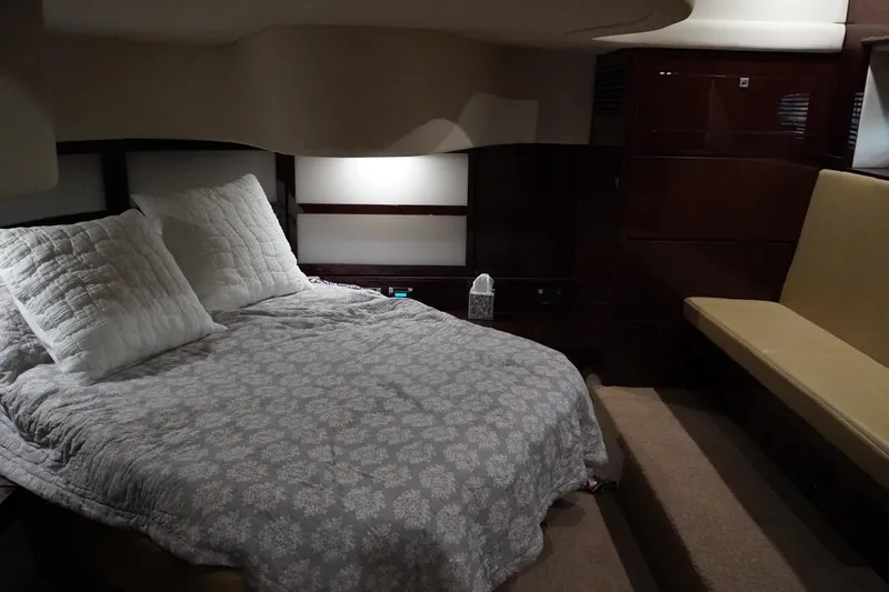 Slide: The Image of Luxurious cabin interior of 2009 Sea Ray 47 Sedan Bridge yacht with cozy bedding. - 42