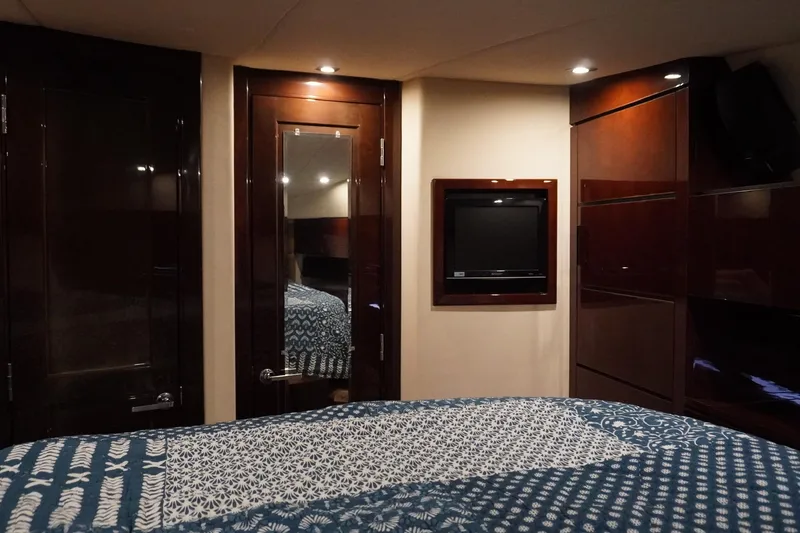 Slide: The Image of Luxurious 2009 Sea Ray 47 Sedan Bridge cabin interior with elegant wood finishes. - 44
