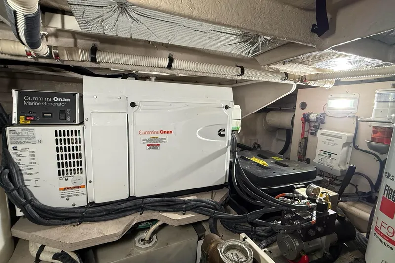 Slide: The Image of Engine room of 2009 Sea Ray 47 Sedan Bridge with Cummins Onan marine generator. - 51