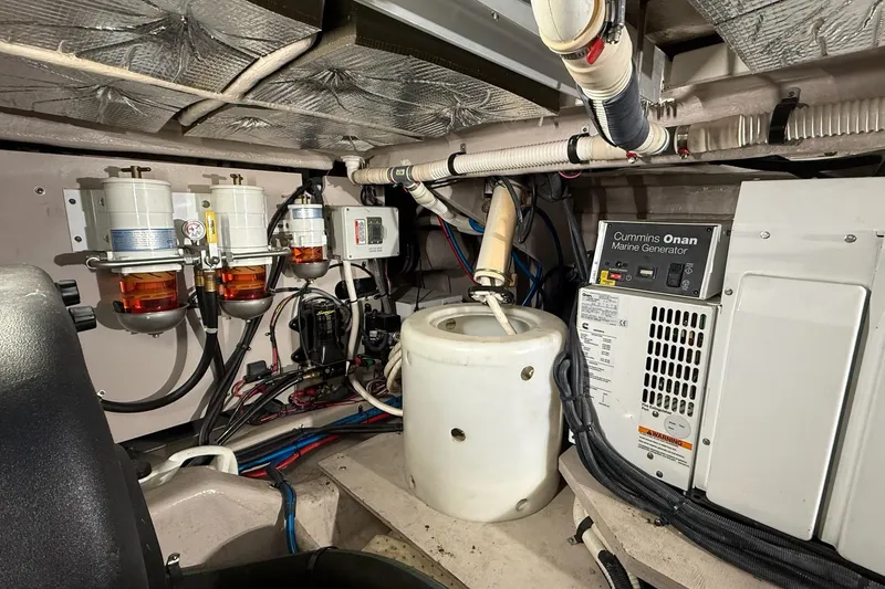 Slide: The Image of Engine room of 2009 Sea Ray 47 Sedan Bridge with Cummins Onan marine generator. - 52