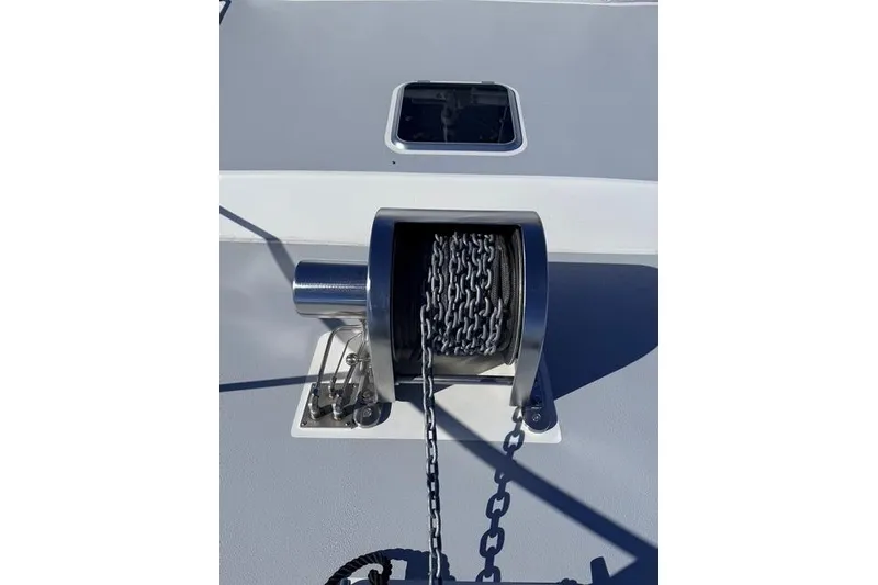 Slide: The Image of Bow view of 2025 Wesmac 42 boat with anchor chain and calm water. - 10