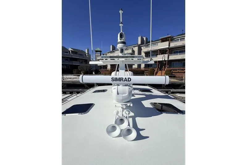 Slide: The Image of Bow view of 2025 Wesmac 42 boat docked in a marina. - 11