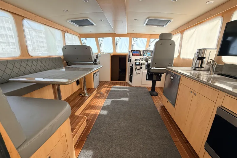 Slide: The Image of Luxurious interior of 2025 Wesmac 42 yacht with modern helm and seating area. - 19