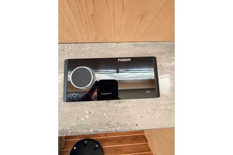 Slide: The Image of 2025 Wesmac 42 interior with helm seat, navigation equipment, and cabin access. - 28