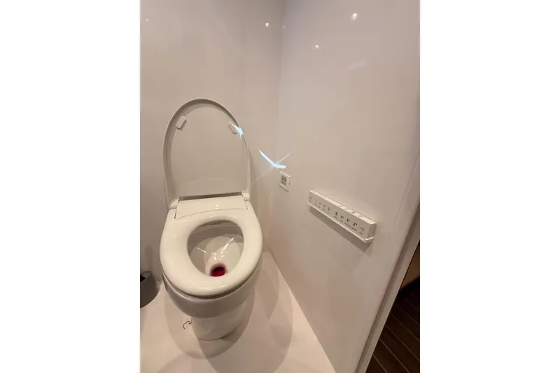 Slide: The Image of Pilothouse interior of 2025 Wesmac 42 with laptop and navigation tools. - 36