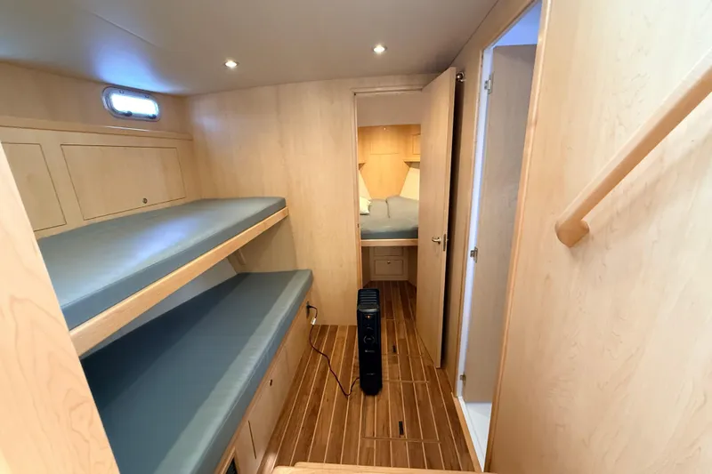 Slide: The Image of Modern bathroom interior of 2025 Wesmac 42 yacht with sleek design and porthole window. - 42