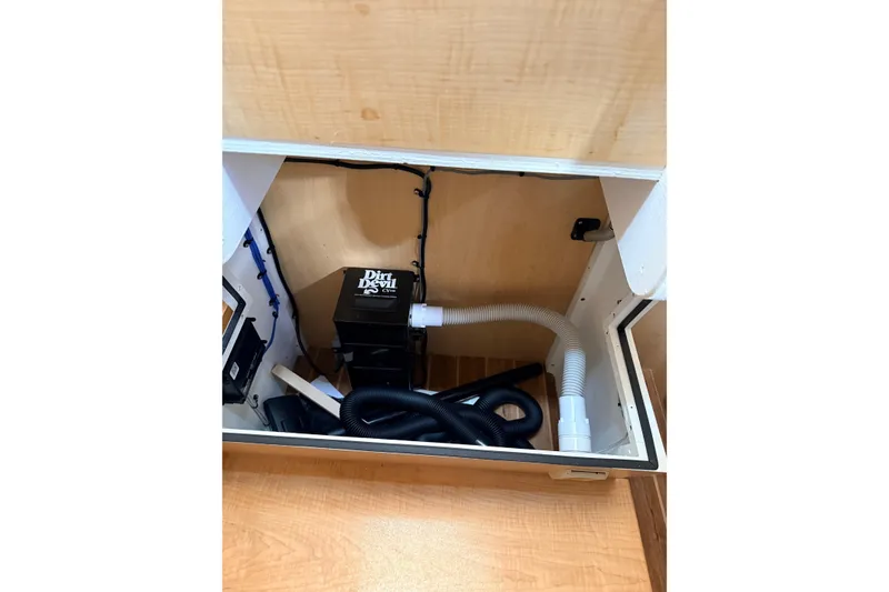 Slide: The Image of 2025 Wesmac 42 interior with wooden finish, bunk beds, and cozy cabin space. - 45