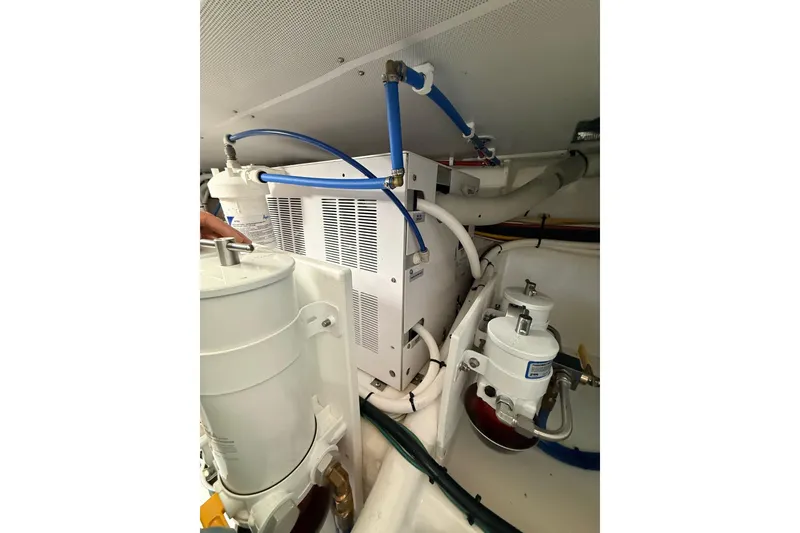 Slide: The Image of Engine compartment of 2025 Wesmac 42 featuring Spot Zero water filtration system. - 52