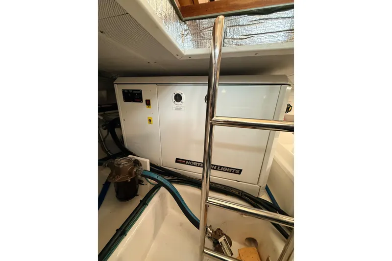 Slide: The Image of Engine room of 2025 Wesmac 42 boat with fire extinguisher and filtration system. - 53